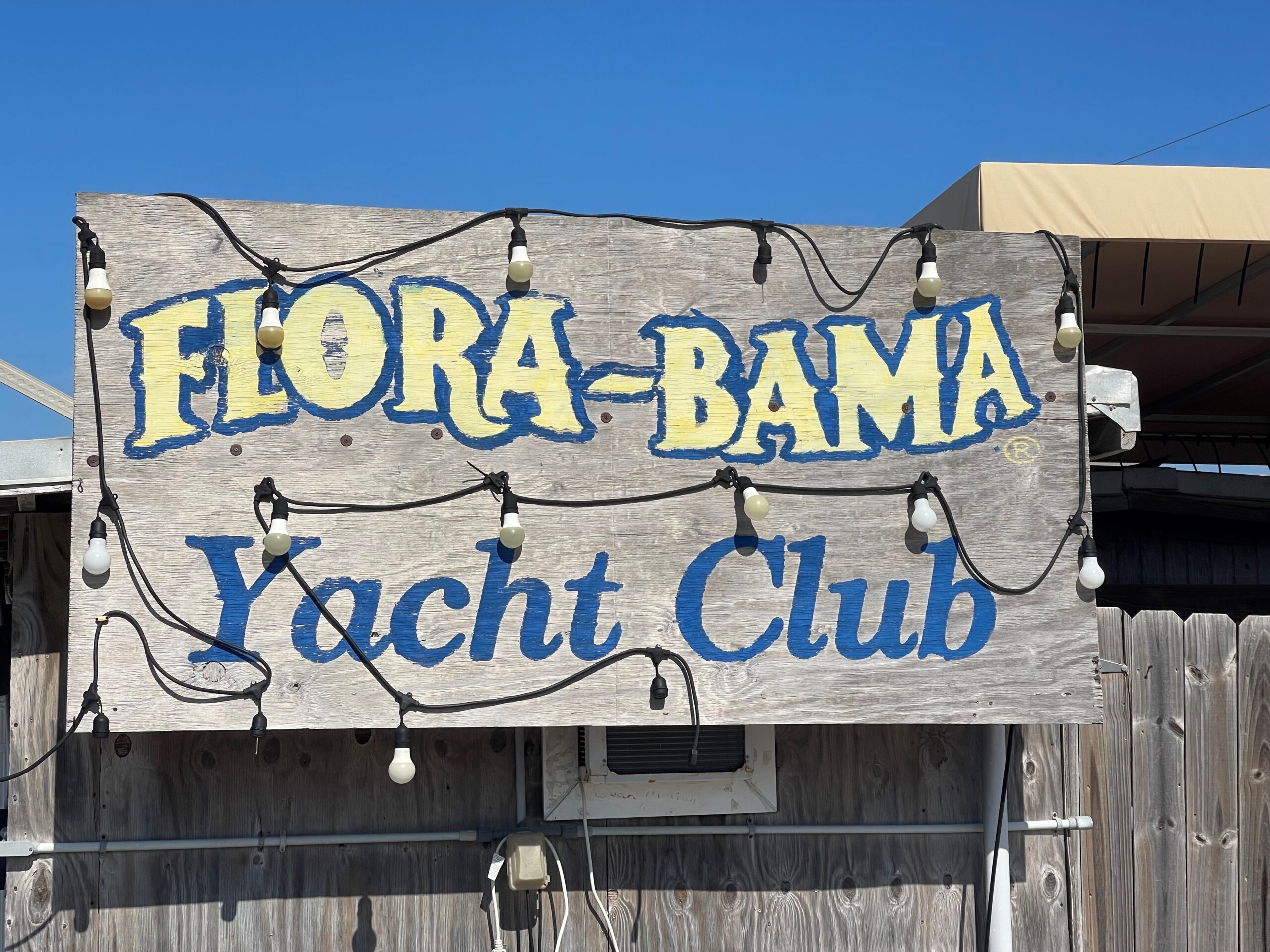 Flora bama yacht club holding with lights